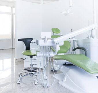 A modern green dental chair setup in a new practice.